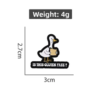 Detailed view of enamel duck pin showing 4g weight and 2.7x3cm dimensions
