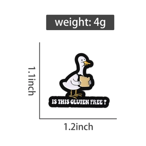 Detail view of cartoon white duck enamel pin with Is This Gluten Free text and dimensions