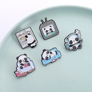 Set of five cartoon panda enamel pins featuring various daily life scenes on a ceramic tray