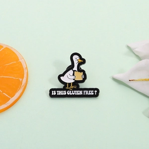 Funny cartoon white goose with bread enamel pin and Gluten Free slogan on green background