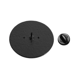 Detail view of the black metal pin back with textured surface and rubber clutch backing