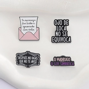 Spanish quote enamel pins with cartoon envelope design in pink and black metal finish