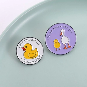 Funny duck and goose enamel pin set with witty phrases in a ceramic jewelry tray