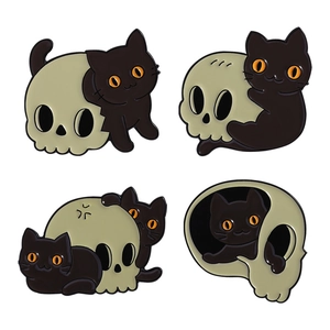 Set of four Halloween enamel pins featuring black cats and skulls on a white background