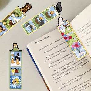 Set of creative cartoon dog paper bookmarks displayed inside an open novel for readers