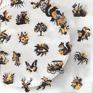 Detail shot of vintage PET waterproof stickers featuring diverse botanical and animal motifs