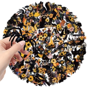 Close-up of waterproof PET nature stickers featuring colorful animal and floral illustrations