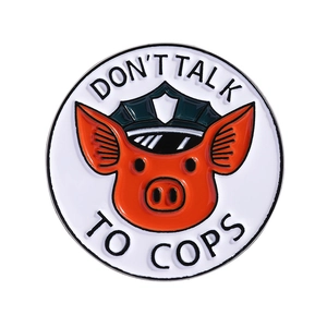 Round pig police officer enamel pin badge with Don't Talk to Cops slogan