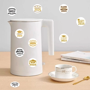 Detail view of 2025 graduation stickers with gold patterns on a white coffee mug