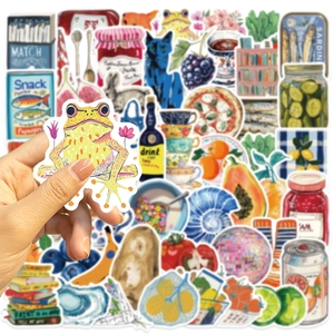 Detail of hand-held Mediterranean aesthetic sticker showing vibrant waterproof DIY designs