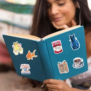 Waterproof aesthetic doodle stickers on blue book with frog and cat cartoon patterns