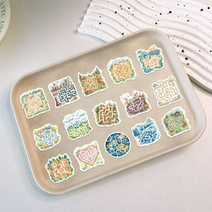 Detailed view of colorful cartoon maze puzzle stickers on a minimalist tray for DIY decoration