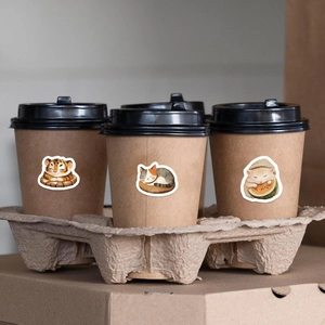 Cute cartoon animal stickers applied on a kraft coffee cup for creative decoration