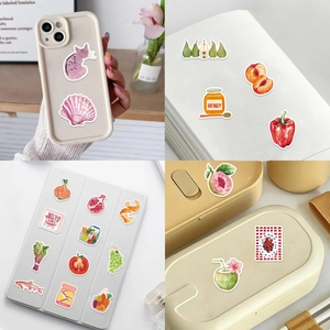 Watercolor Mediterranean stickers on laptop and phone case showing diverse DIY designs
