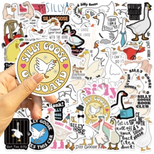Macro detail of waterproof vinyl silly goose stickers on laptop with funny cartoon designs