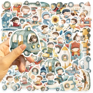Close-up of hand holding a waterproof cartoon vehicle sticker with assorted DIY decal set