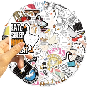 Close-up of waterproof cartoon duck stickers for laptops with humorous English slogans