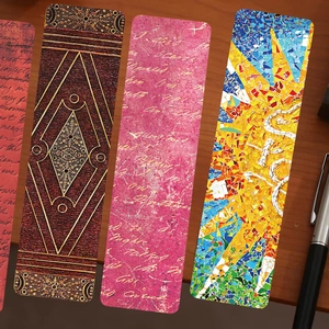 Set of four artistic oil painting bookmarks with vintage patterns on a wooden desk