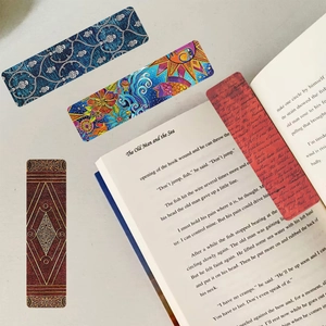 Artistic oil painting bookmarks with vintage floral and abstract patterns on a book