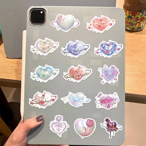 DIY waterproof heart graffiti art stickers set displayed on a grey tablet computer back