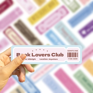 Close-up of vintage Book Lovers Club ticket sticker held by hand for journal DIY decor