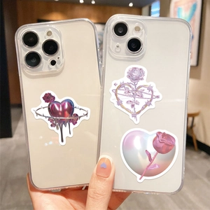 Detail of Y2K aesthetic liquid metal heart and rose stickers on a phone case