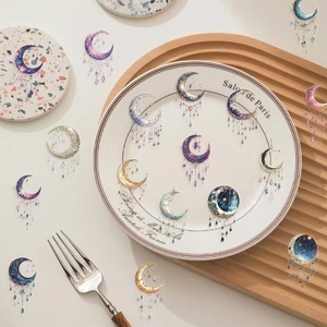 Detail view of waterproof moon and galaxy stickers with transparent PET textures