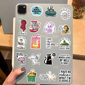 Funny internet meme graffiti stickers on a tablet back showing waterproof PVC texture