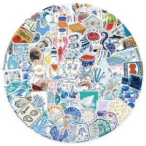 Macro display of waterproof PVC stickers featuring coastal life and summer travel illustrations