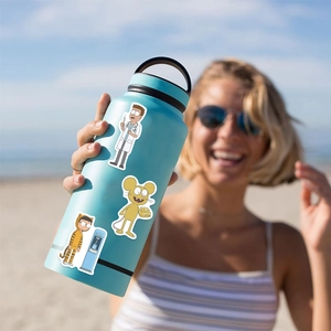 Waterproof Rick and Morty cartoon stickers displayed on a blue water bottle outdoors