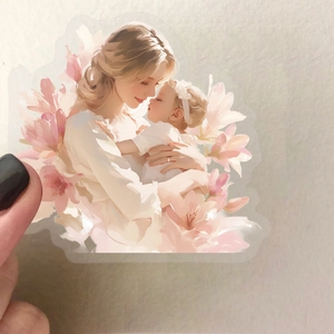 Detailed view of clear PET sticker depicting a mother holding a baby with floral accents