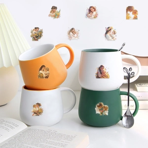 Detail of waterproof flower stickers applied to ceramic mugs with warm artistic style