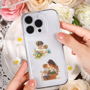 Close-up of clear iPhone case featuring watercolor mother and child art design