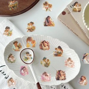 Close-up of watercolor Mother's Day stickers with floral and warm family illustrations