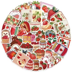 Close-up of assorted waterproof strawberry stickers featuring cute cartoon animals and desserts