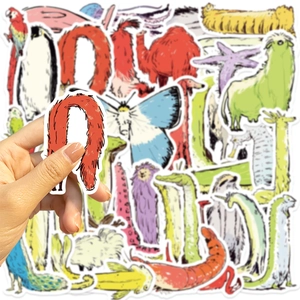 Detail showing a person holding a long neck animal sticker from a bulk decorative set