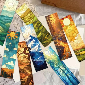 Vista plana de marcapáginas artísticos estilo vitral con paisajes vibrantes