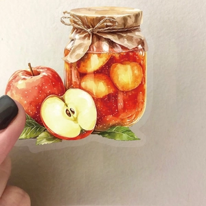 Dettaglio ravvicinato di un adesivo vintage ad acquerello con marmellata di mele arancio