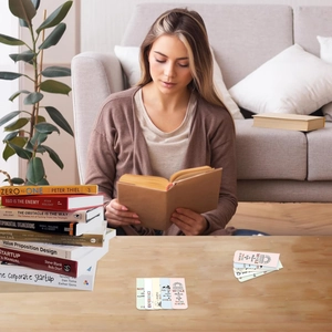 Close-up of magnetic bookmarks with inspirational quotes used in a cozy reading scene