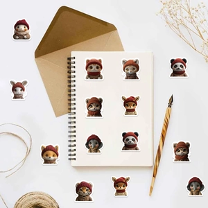 Flat lay of cute cartoon animal stickers featuring cats and pandas on a journal page