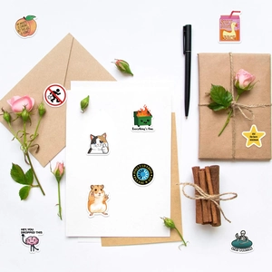 Close-up of decorative cartoon stickers with cat and hamster patterns for DIY journals