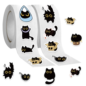 Close-up of cute black cat thermal stickers roll with various playful cartoon poses