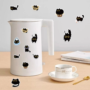 Cute black cat cartoon stickers applied on a white kettle for home decoration