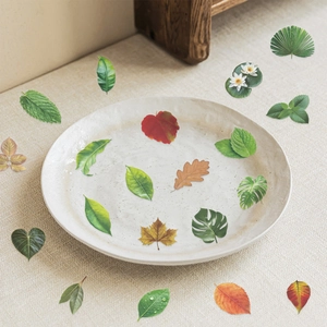 Macro view of realistic waterproof PET leaf stickers with fine vein details for journaling