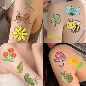Detailed view of colorful cartoon insect temporary tattoos applied to skin for kids party