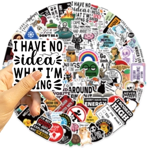 Close-up of waterproof PVC prank meme stickers for DIY decor on laptops and guitars
