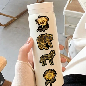 Dettaglio di un thermos bianco con adesivi artistici neon di animali e fiori colorati