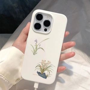 Detailed close-up of white iPhone case featuring delicate orchid floral illustrations