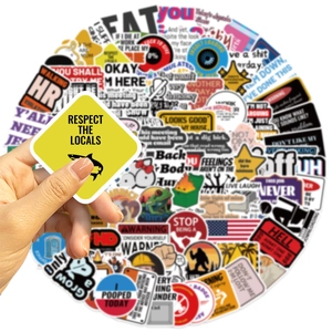 Close-up of waterproof vinyl meme stickers featuring humor slogans for laptops and luggage