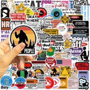 Close-up of waterproof funny prank meme stickers for DIY laptop and guitar decoration